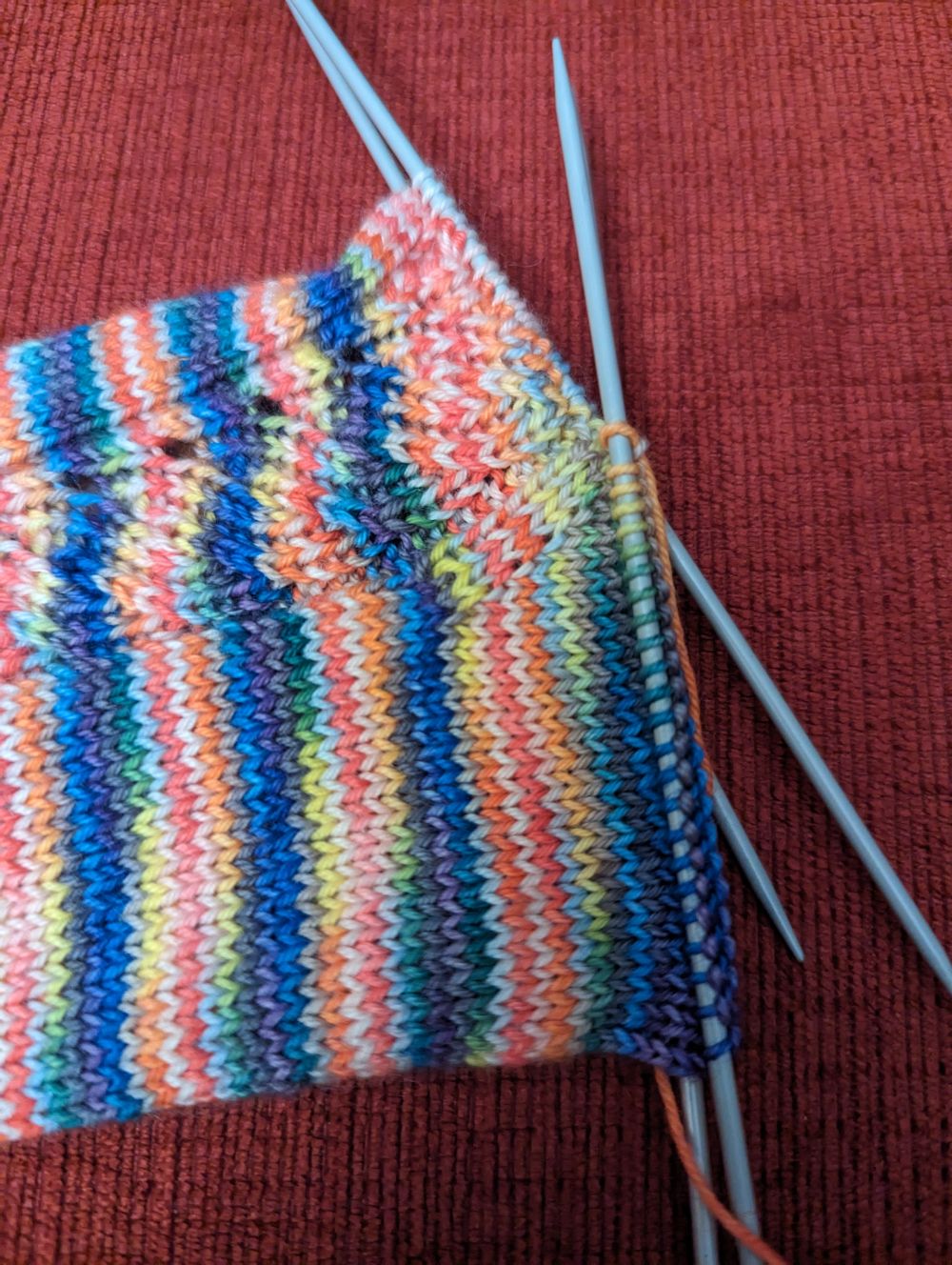 The in-progress gusset increases of a toe-up sock.