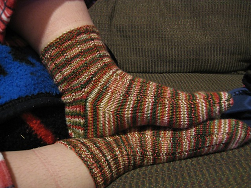 Photo of the socks in the process of being worn.