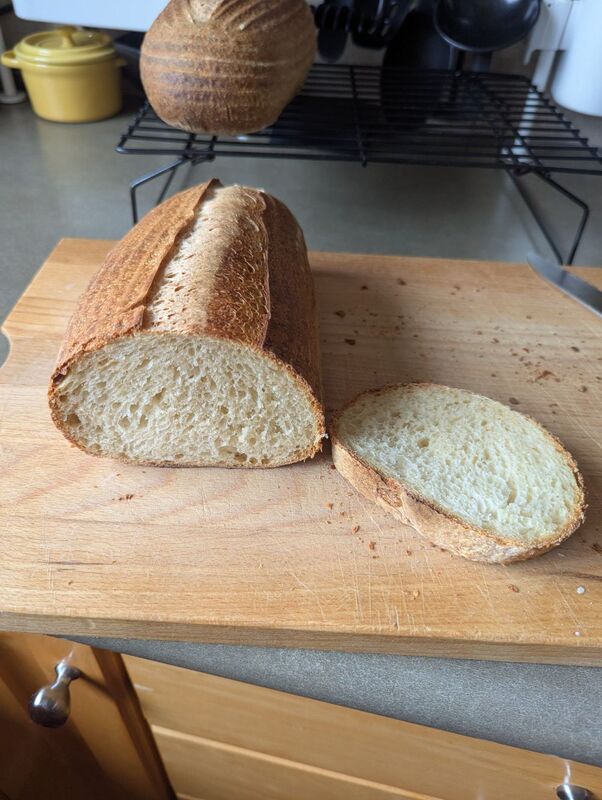 Sliced sourdough showing better crumb than last time.