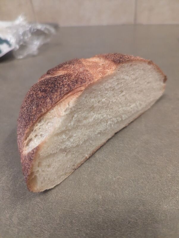 Shot of crumb from sourdough boule, tight but reasonably airy, similar to a commercial french bread.