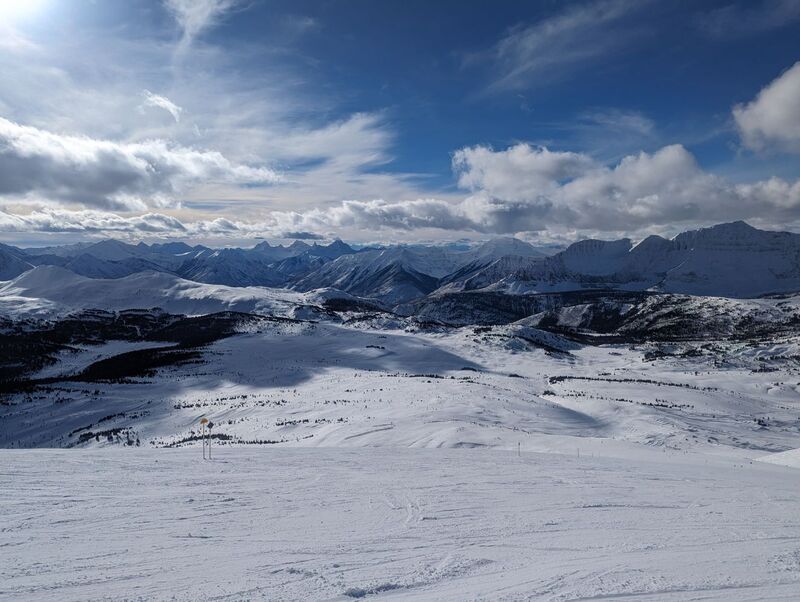 A view south off the top of the Great Divide chair up at Sunshine Village during a beautiful sunny day.