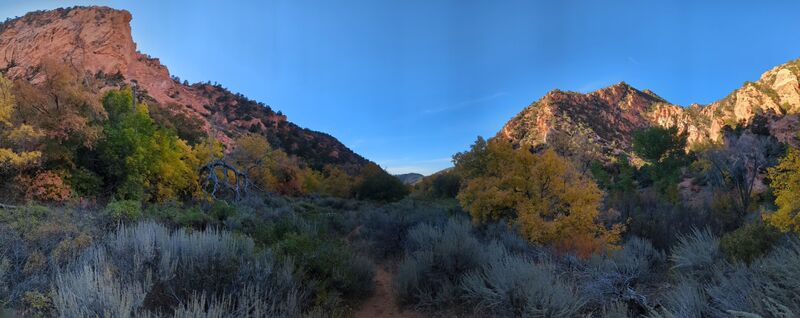 A panorama of the valley on the return trip, the valley half in shadow in the late day sun.