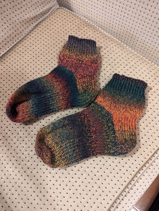 Photo of the two completed socks lying side-by-side.