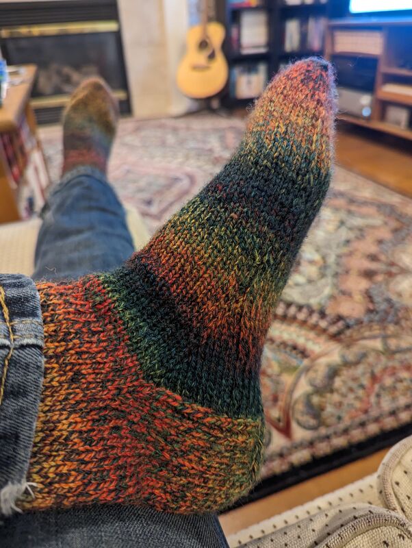 A shot of one of the socks on my foot (and my guitar in the background).