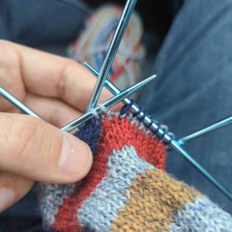 The row after the short row join can sometimes have a gap that can be filled by picking up, twisting, and knitting into the leg below.