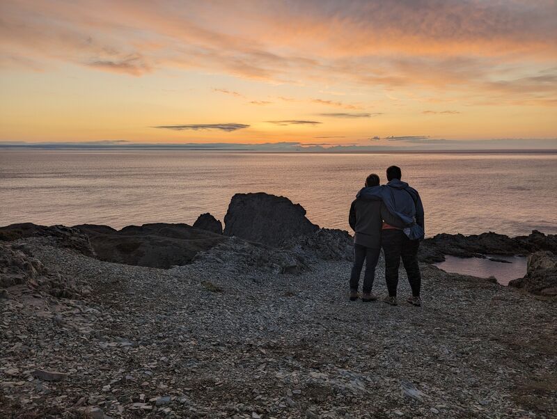 Lenore and I taking in a sunset up near the lighthouse in Crow Head, our backs to the camera.