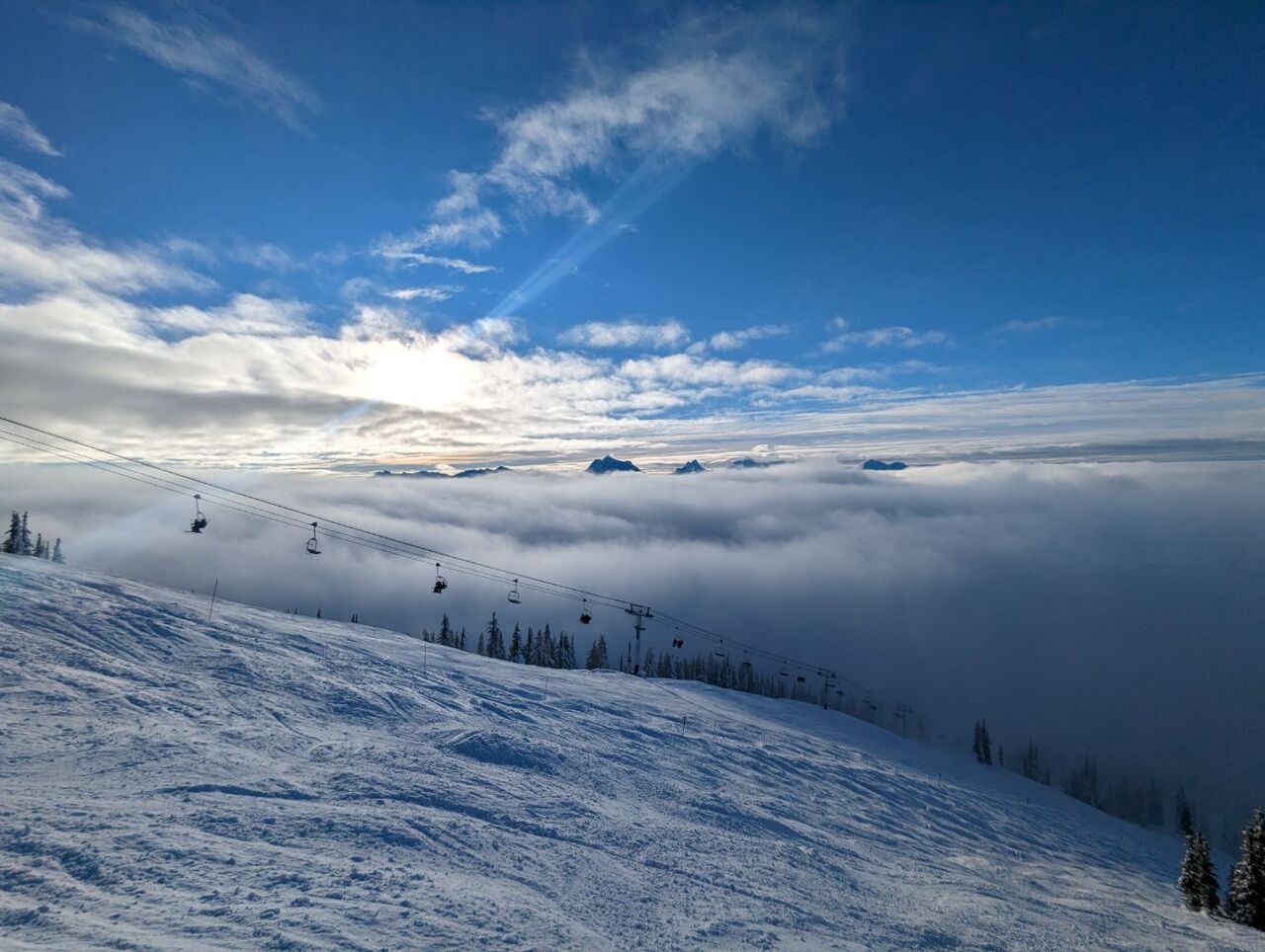 An inversion layer dominated the first two days of skiing.  In this photo you can see the cloud layer that formed mid-mountain.